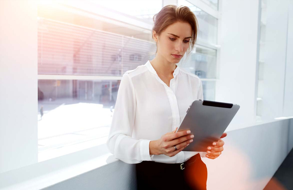 What should your marketing team do in a recession: Woman shopping on tablet