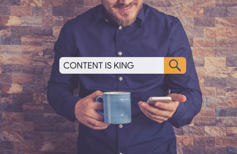 Man searching for content on phone (Is Content is King Dead?)