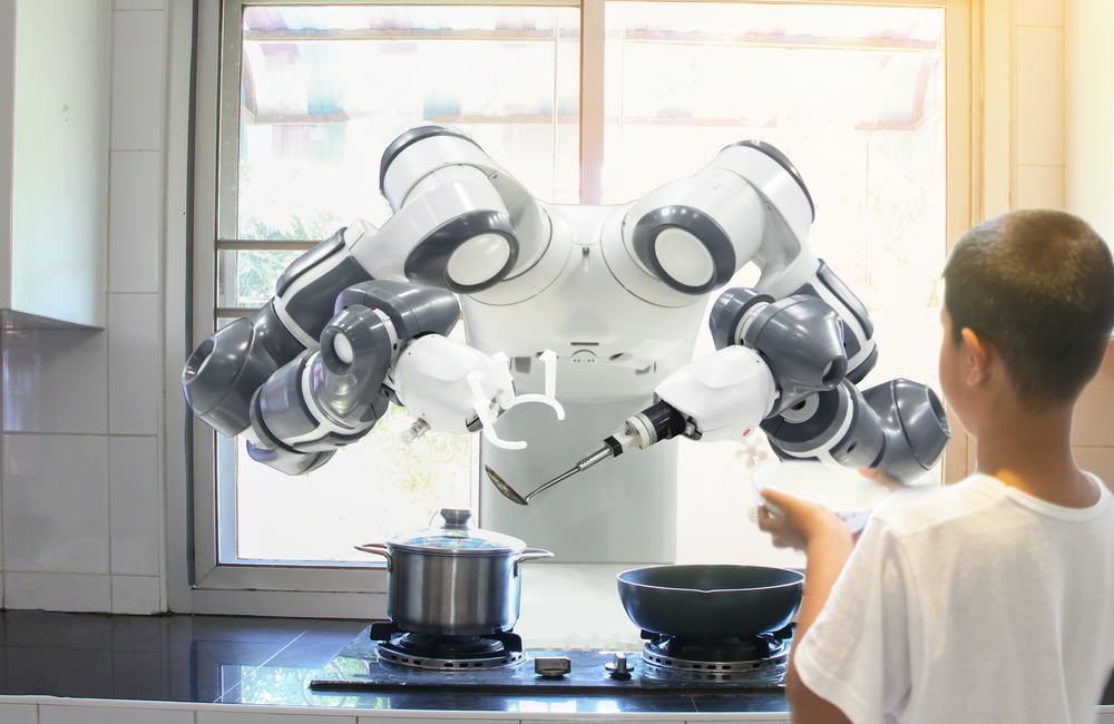Robot "chef" prepares meal for boy to illustrate future digital trends
