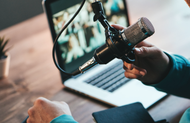 Man talking into podcast microphone to illustrate the concept of content marketing in action