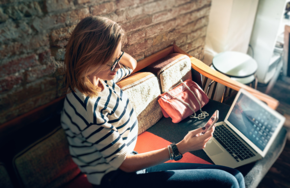 Photograph of woman putting together content marketing post to illustrate content marketing in action