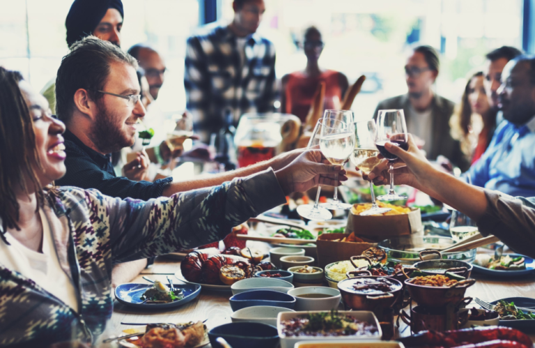 Photo of people sharing a meal and expressing their gratitude to one another