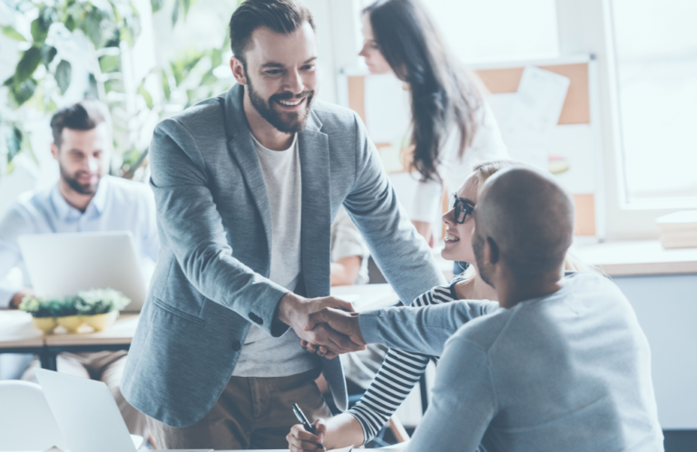 Group of people shaking hands on a deal to illustrate the idea of human connection and 