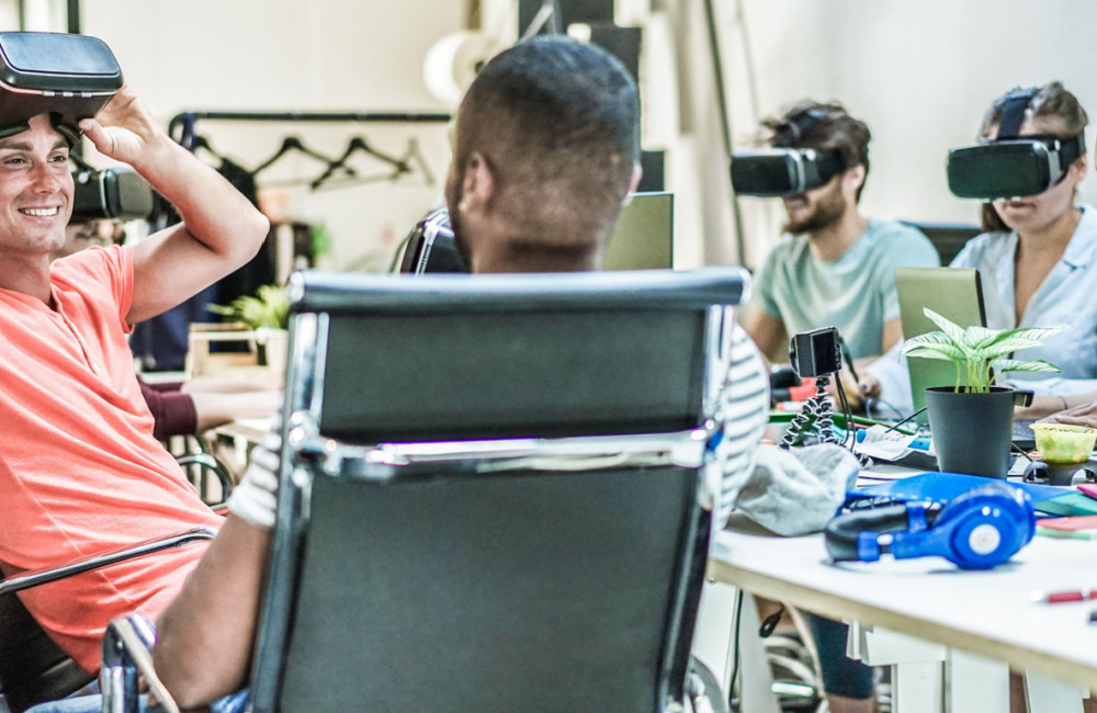 Group of marketers using VR headset to illustrate how to market new products and services