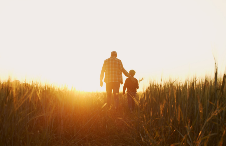 Photo of farmer and his son walking at dawn to illustrate Amazon's "Day One" mindset