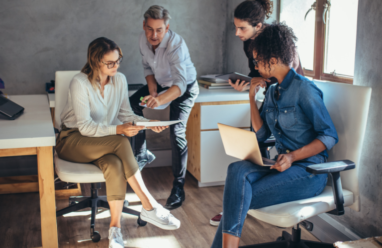 Team of people brainstorming how their business can escape Big Tech's web.