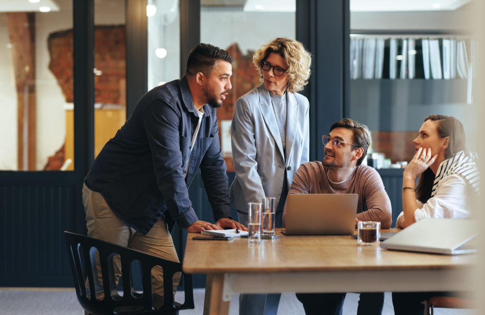 Photo of team collaborating to illustrate idea of top digital marketing trends in 2024